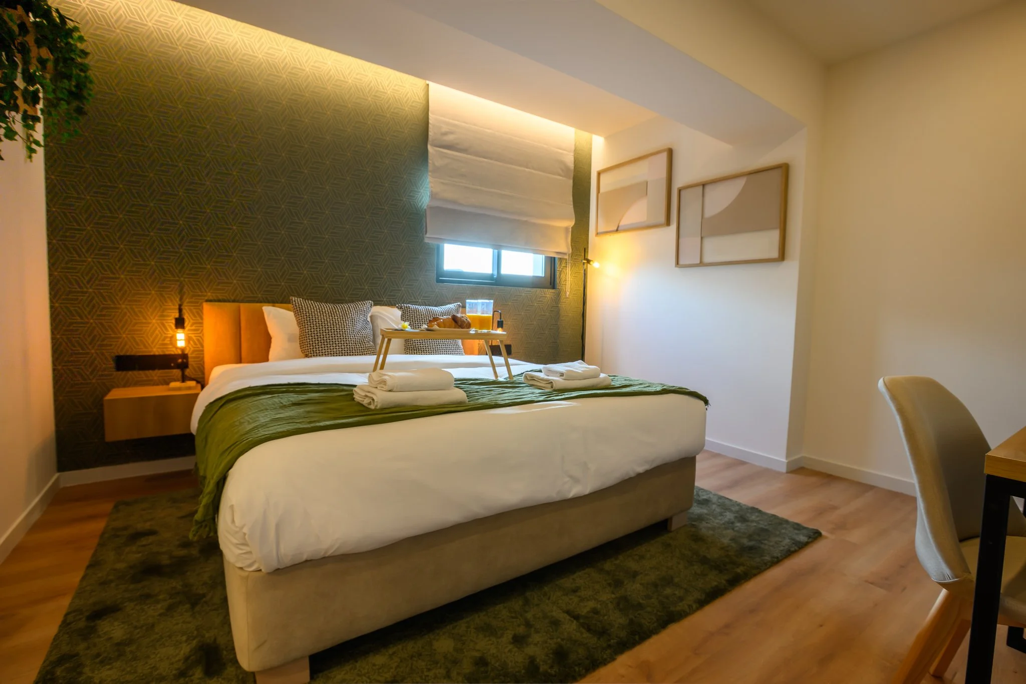 Nisia Suites Classic Suite bedroom with desk, Nicosia