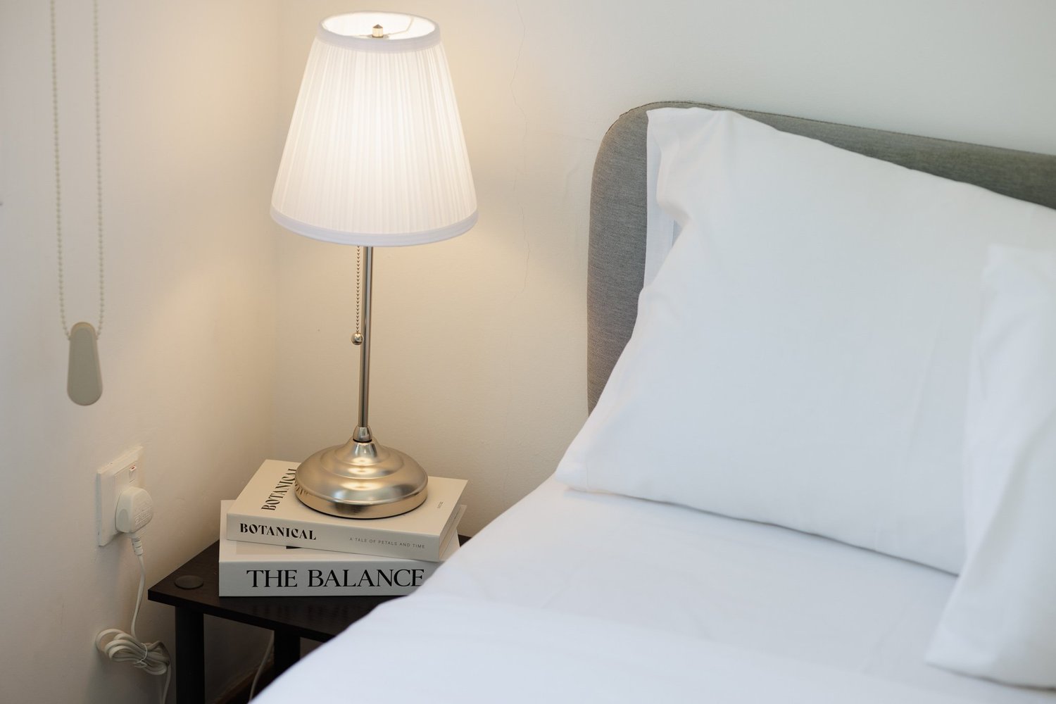 Antoinette Court — Reading lamp by the bed