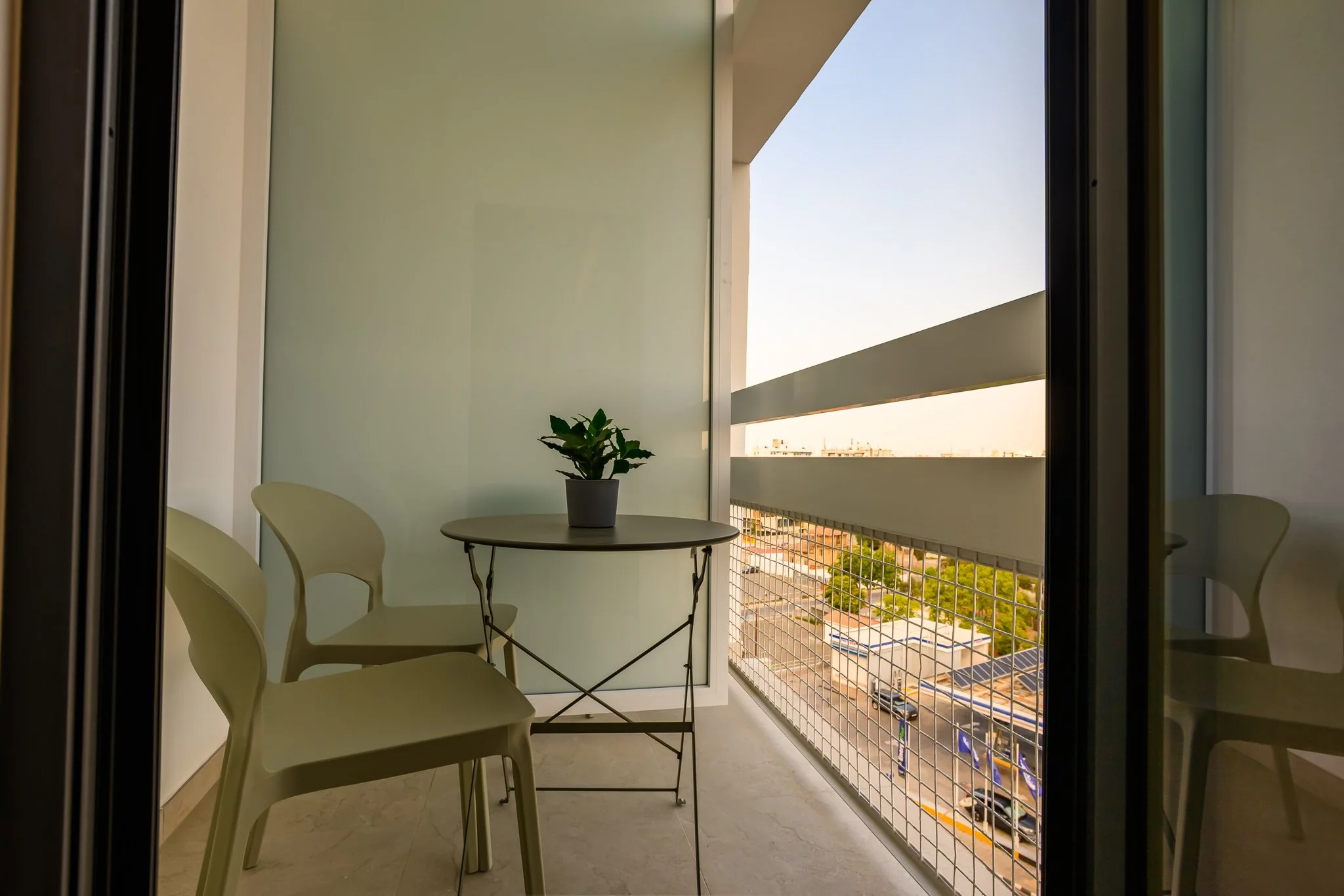 Nisia Corner Suite — Private balcony with bistro table