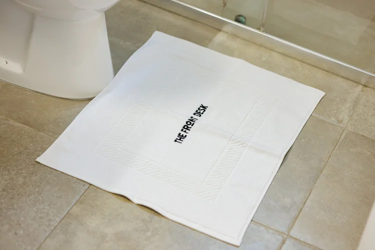 Antoinette Court amenity — The Front Desk bath mat