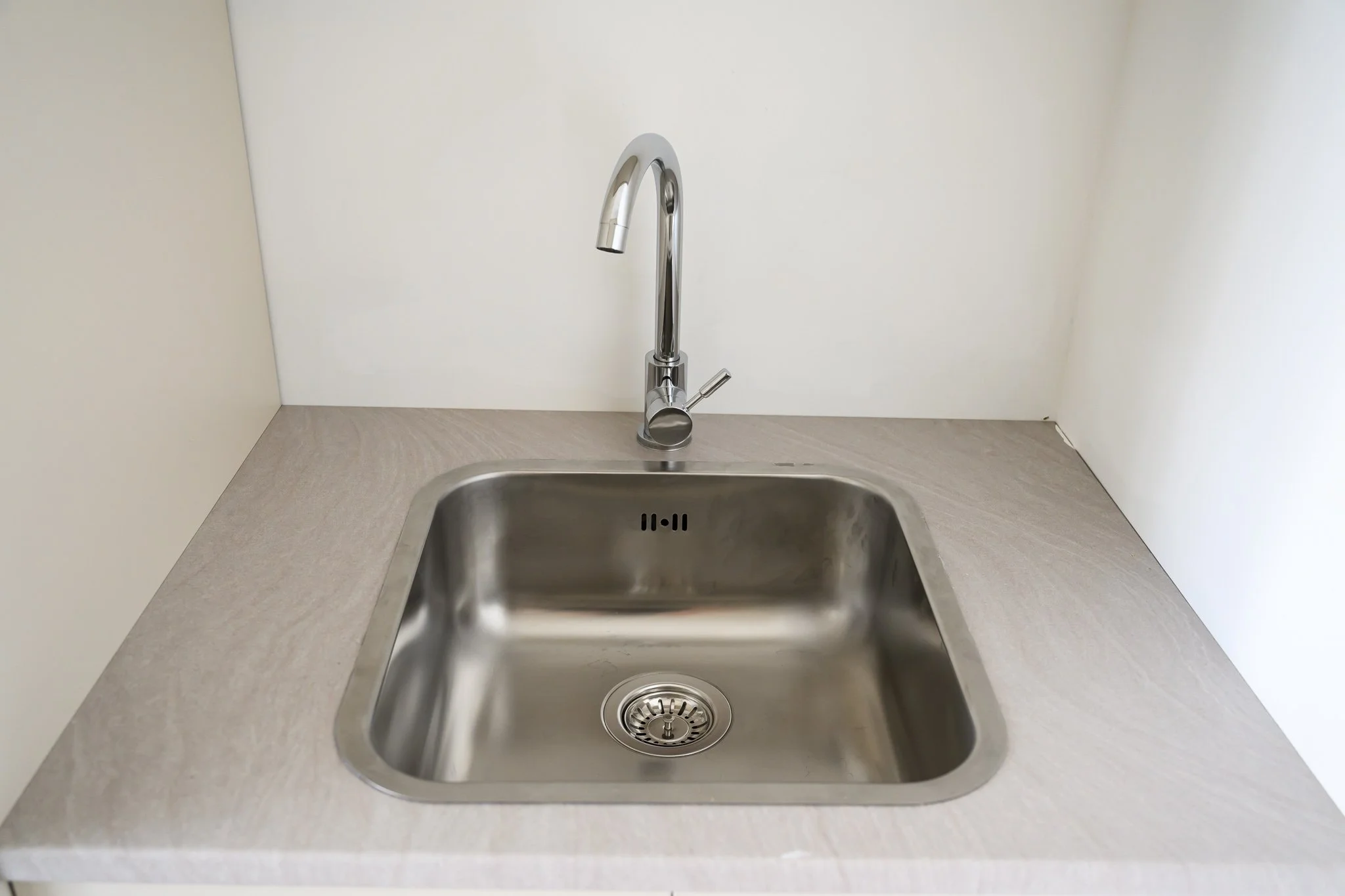 Utility sink in the shared laundry room, Nisia Suites