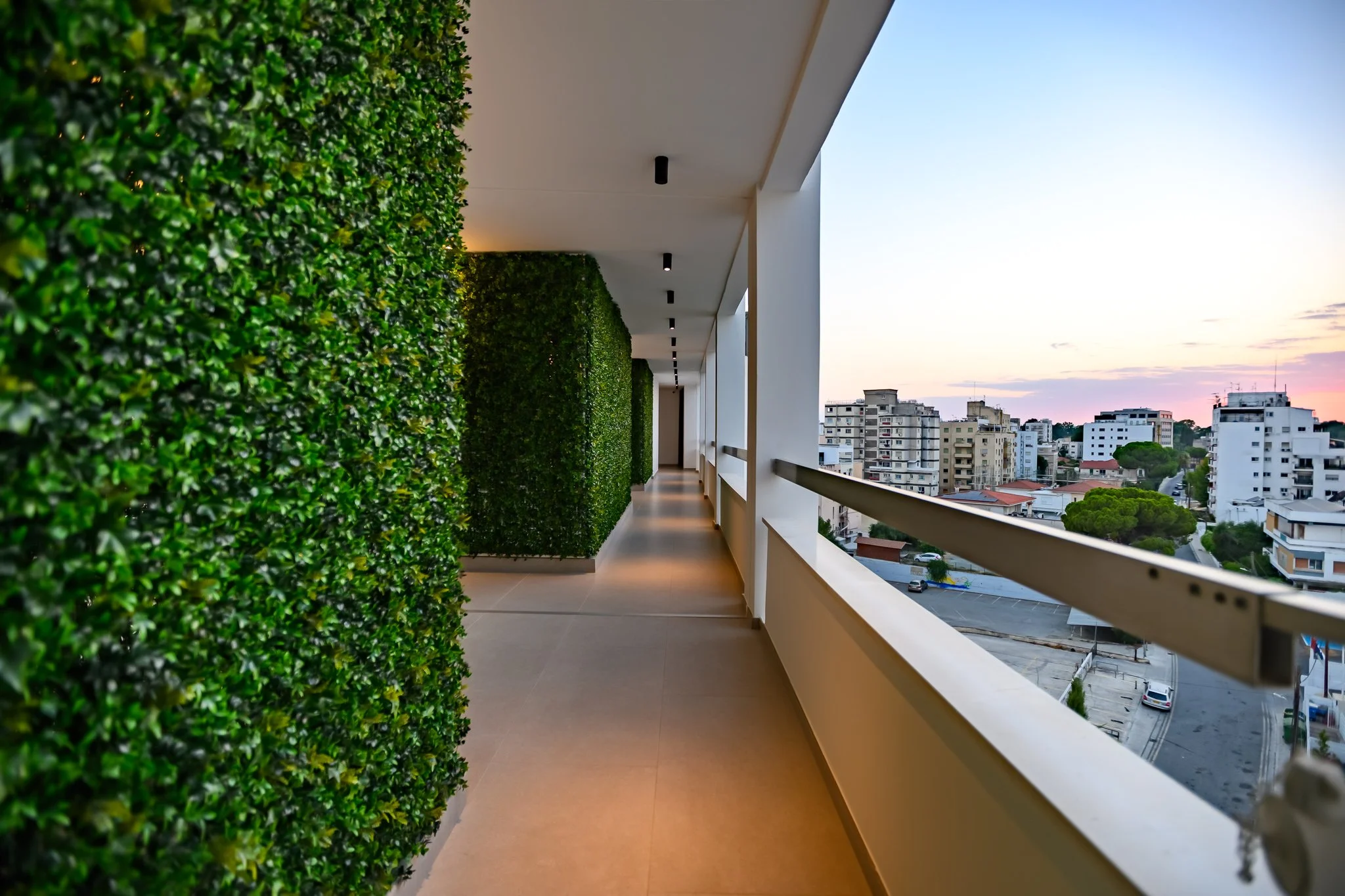 Nisia Suites building — Top-floor corridor at sunset