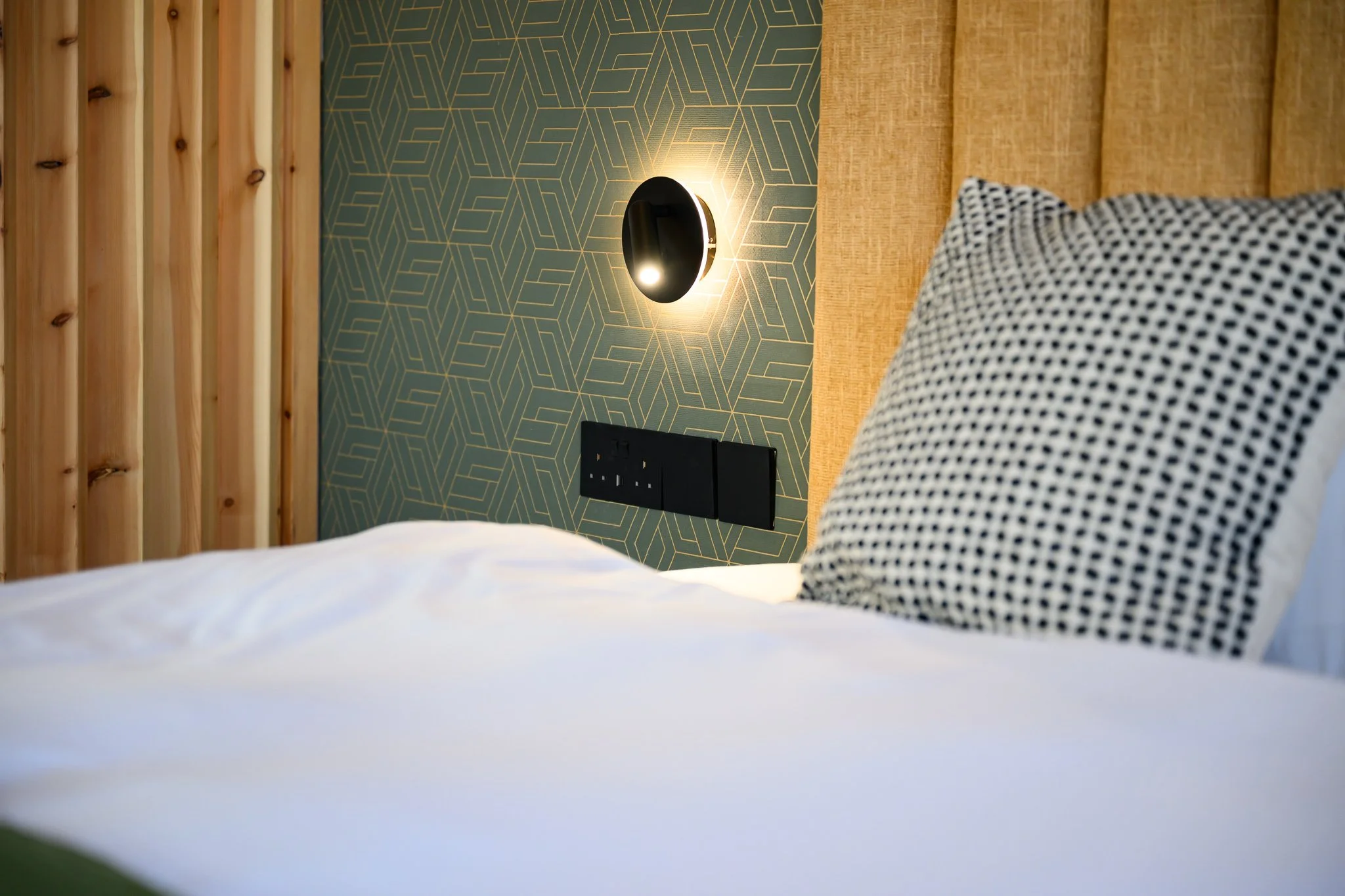 Nisia Corner Suite amenity — Bedside USB-A, USB-C and sockets