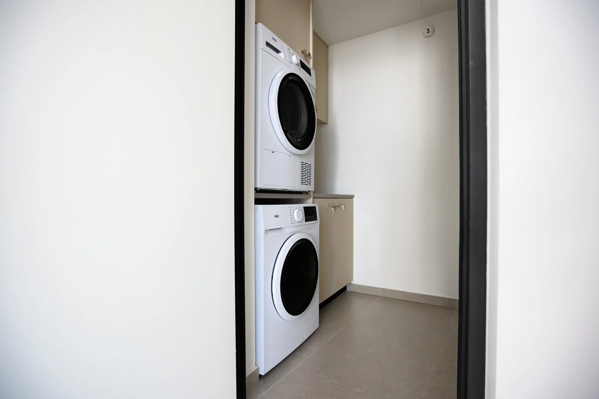 Washer-dryer in the shared laundry room, Nisia Suites
