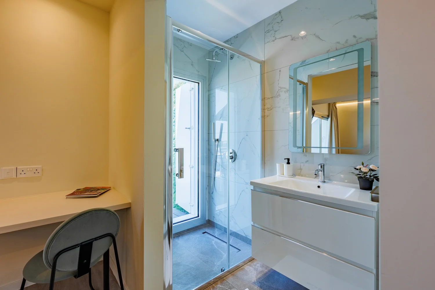 The Palm Suites Suite 2 — Walk-in shower, vanity and desk