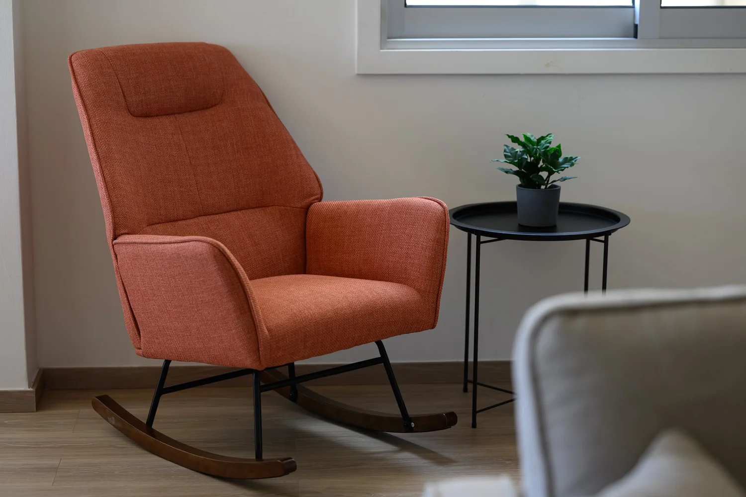 Calian Court — Rocking chair by the window