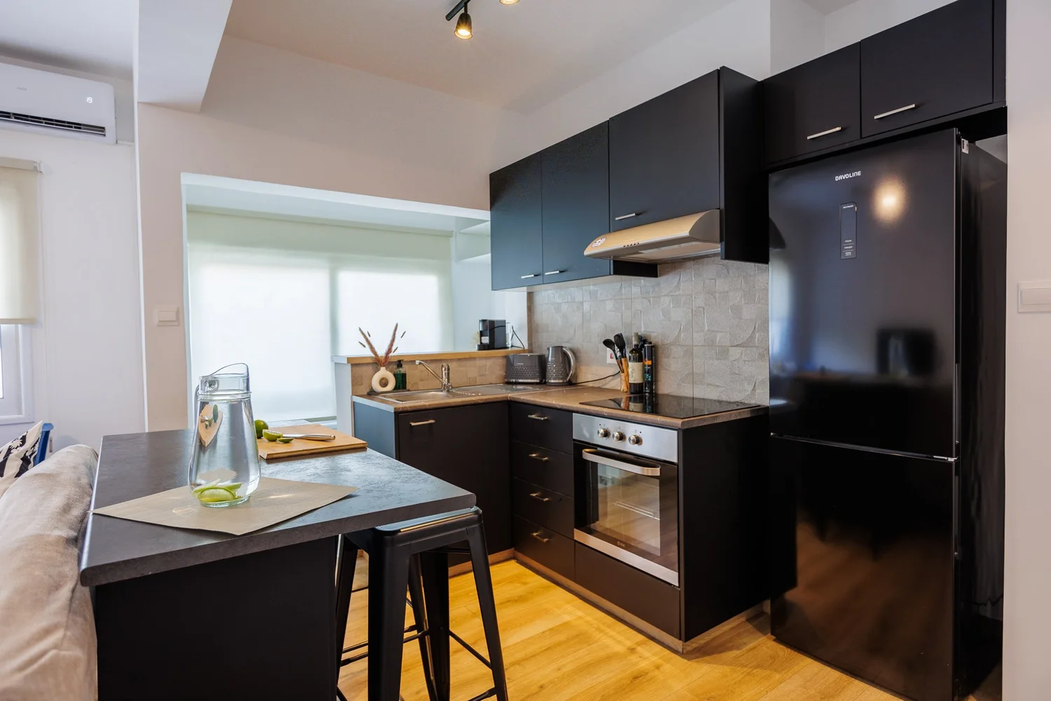 Antoinette Court — Kitchen island with bar stools