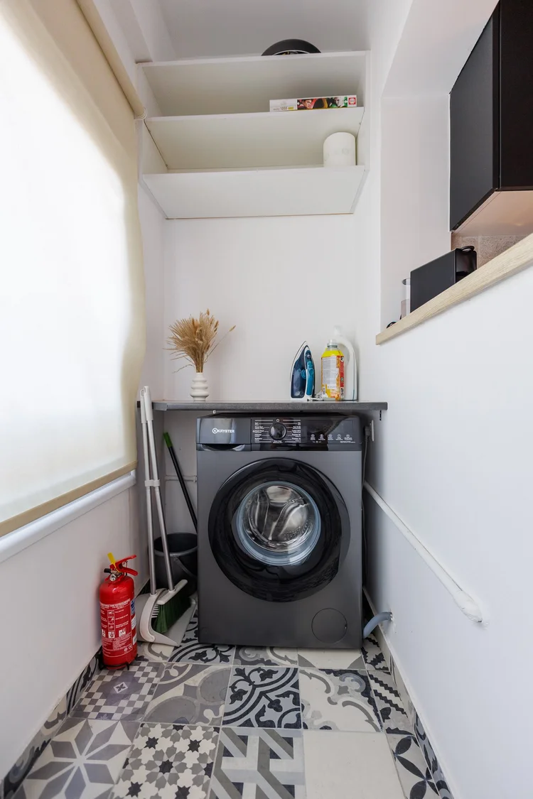 Antoinette Court amenity — Laundry corner with washing machine