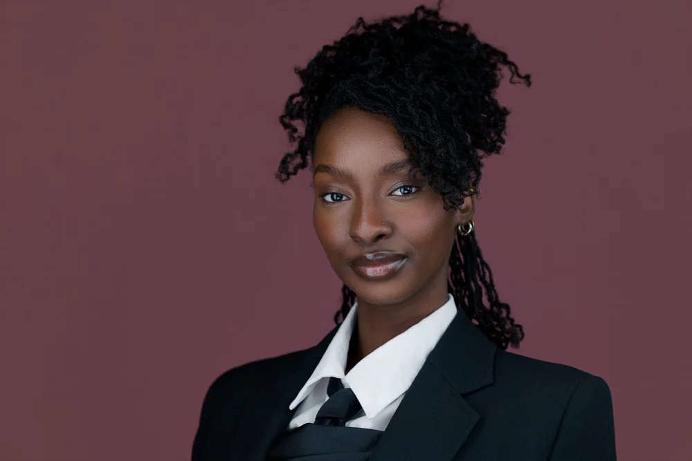 Professional headshot of a woman in a black suit, Central New York corporate headshots