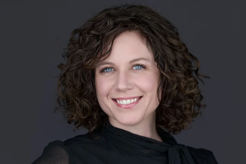 Professional headshot on a dark background, corporate headshots Syracuse NY