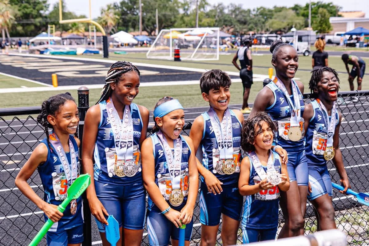 Freeze Effect athletes celebrating together after a track meet