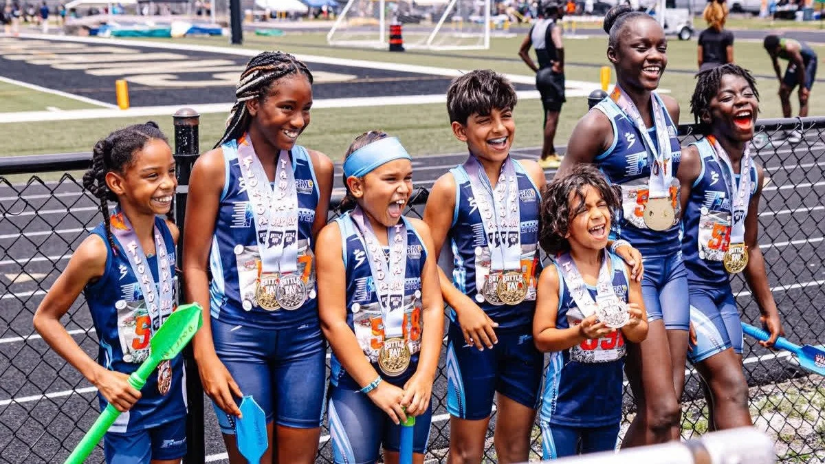 Freeze Effect athletes celebrating together after a track meet