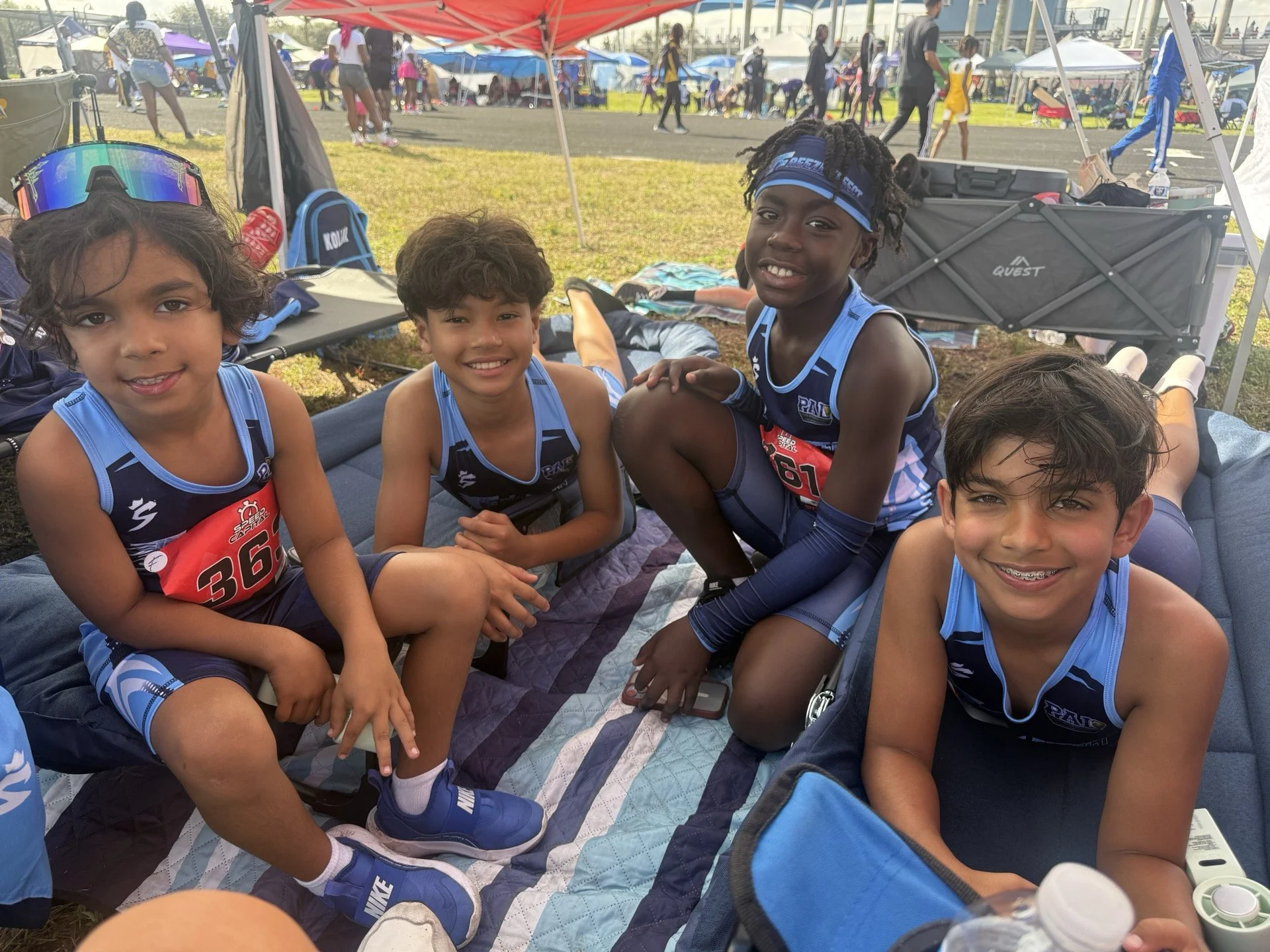 Four young athletes at meet