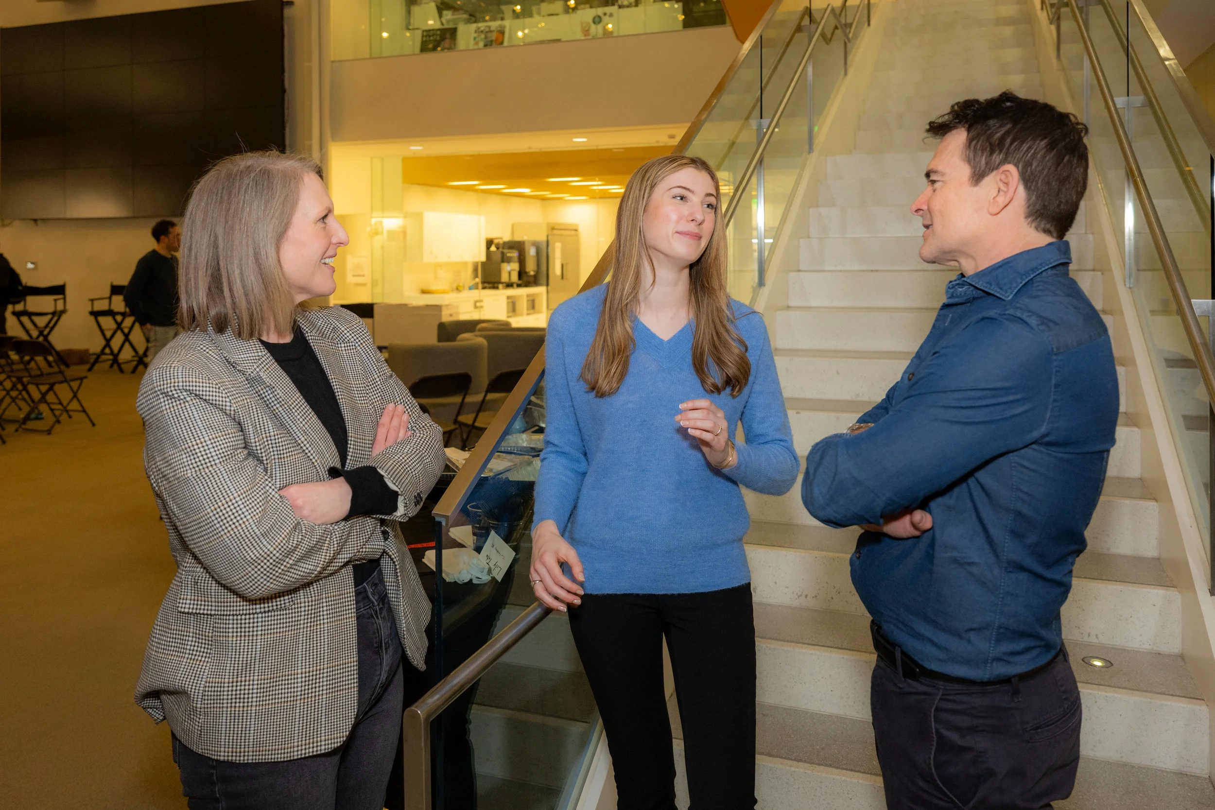 Reed Frerichs in conversation with two colleagues at an MIT event