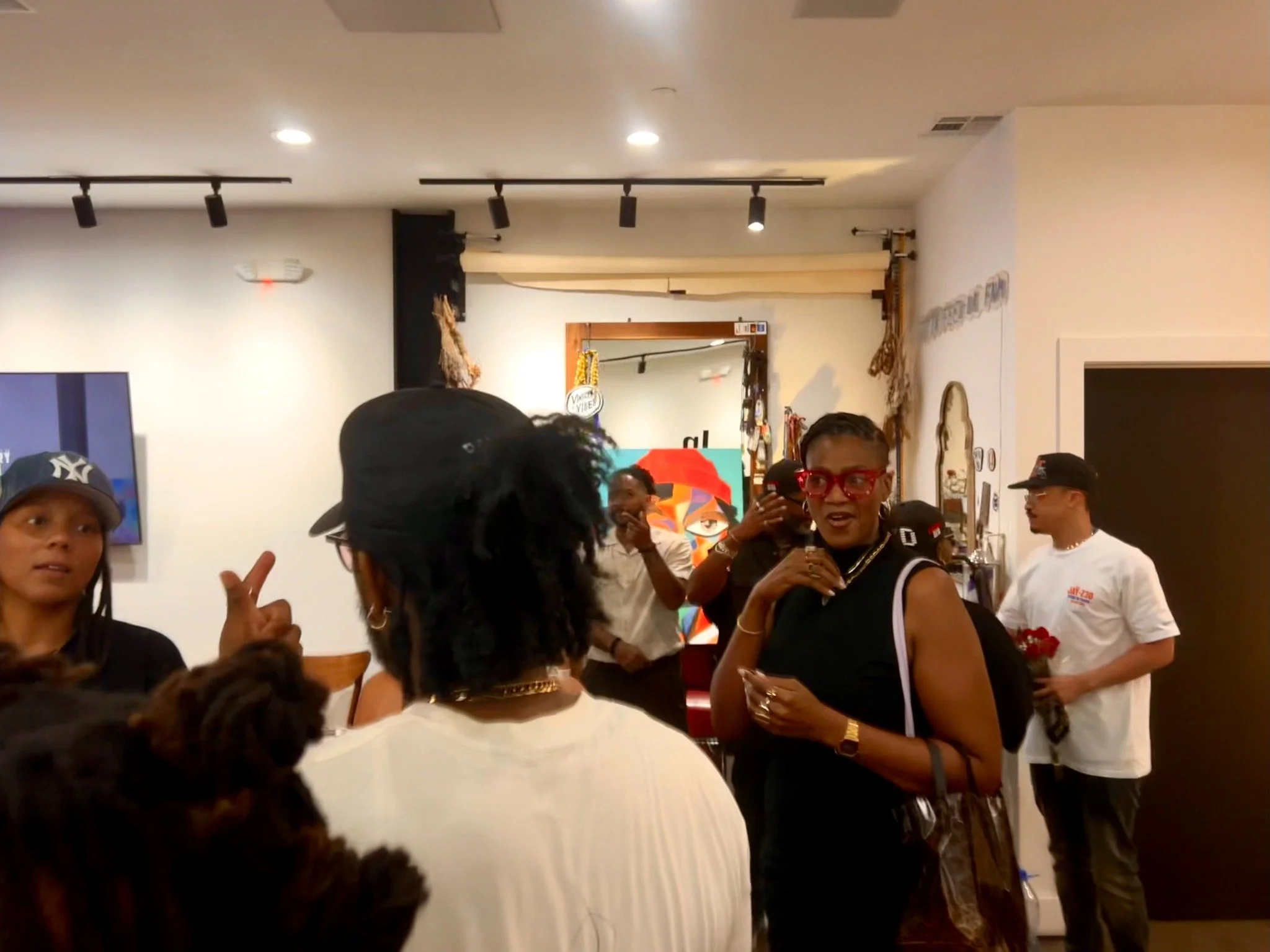 Visitors connecting inside the In Every Form exhibition at CoolxDad.