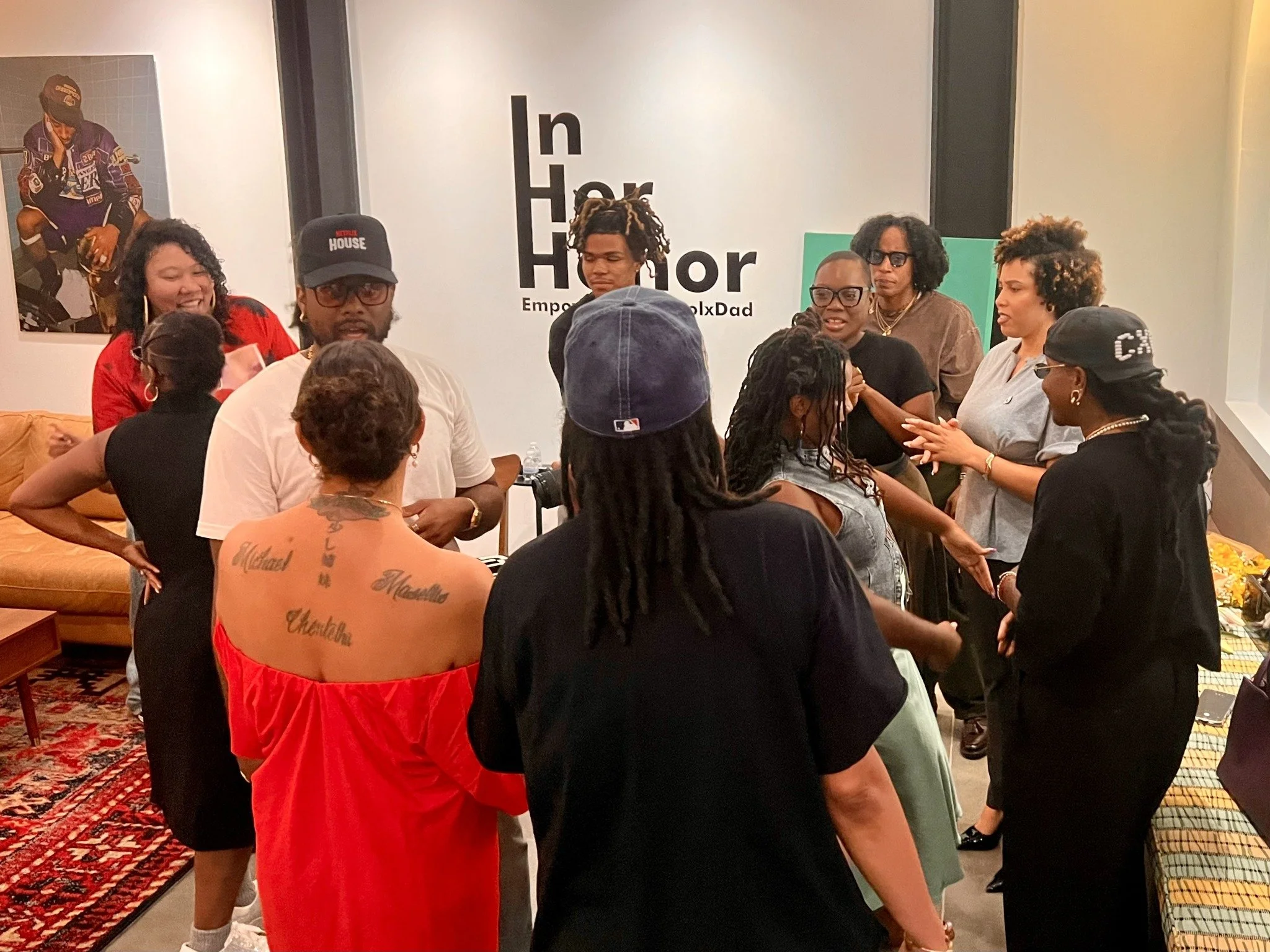 Guests gathered for the artist conversation in front of In Her Honor.