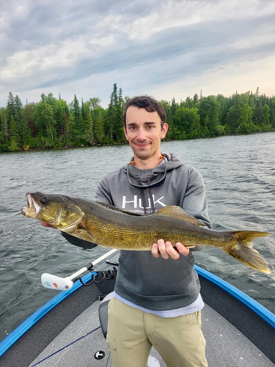 An angler holding a trophy walleye caught on Trout Lake in Ontario Canada.