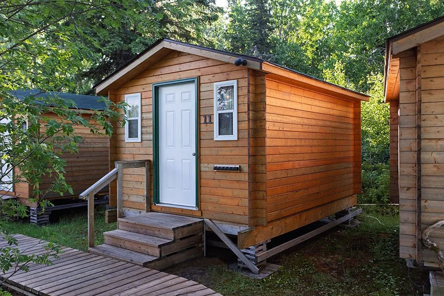 Private cabin surrounded by trees at Cat Island Lodge