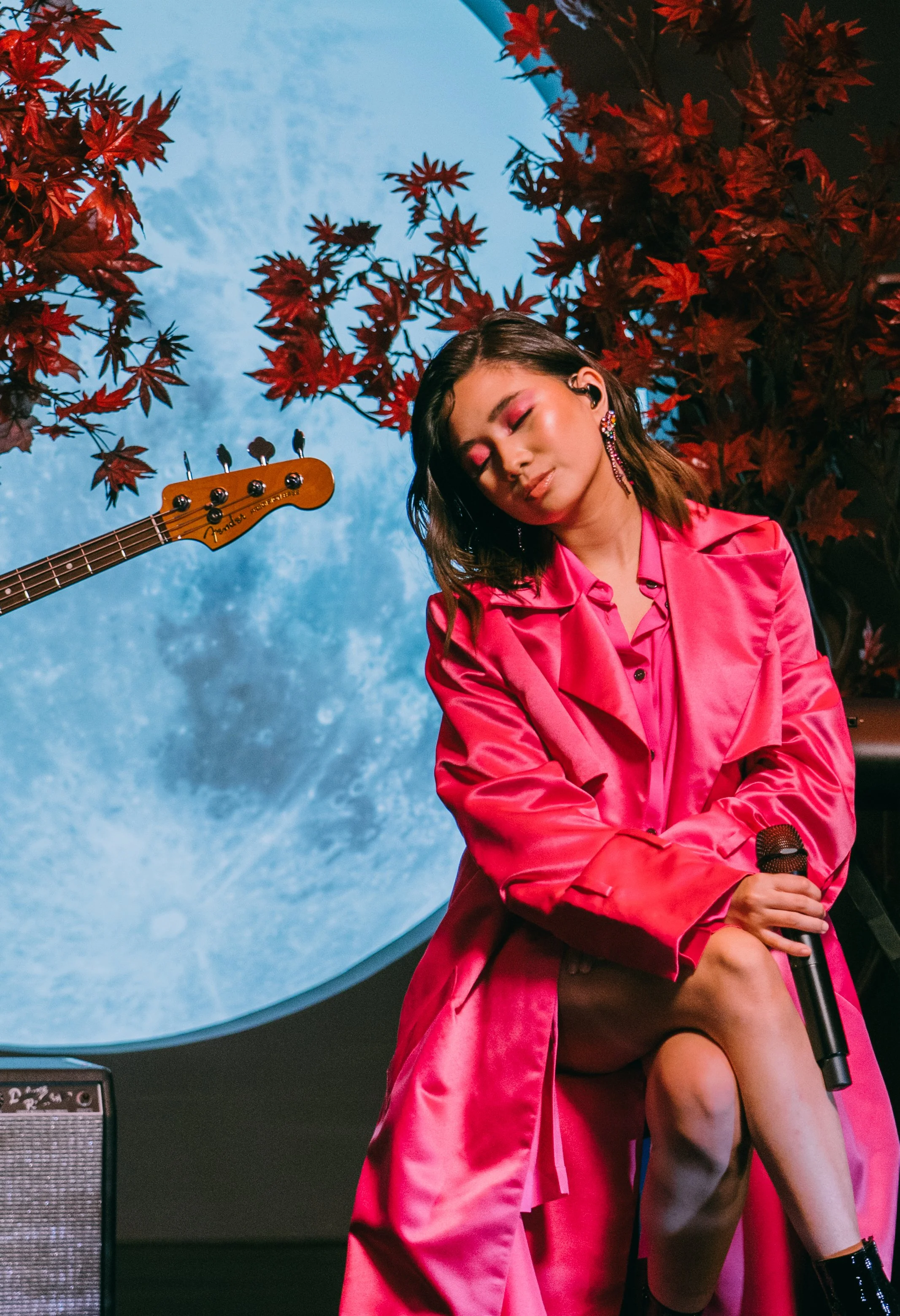 Hayley Kiyoko on water-reflected stage