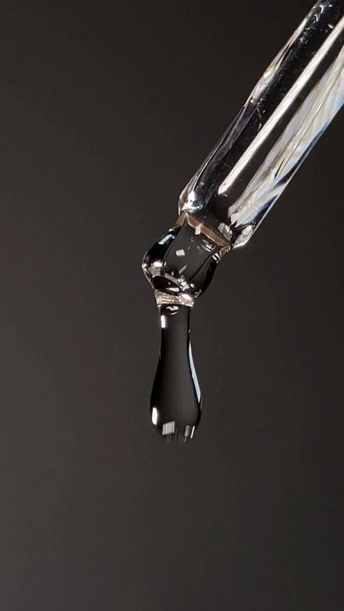 Custom serum applied with a precision dropper during the Facials and Flowers ritual