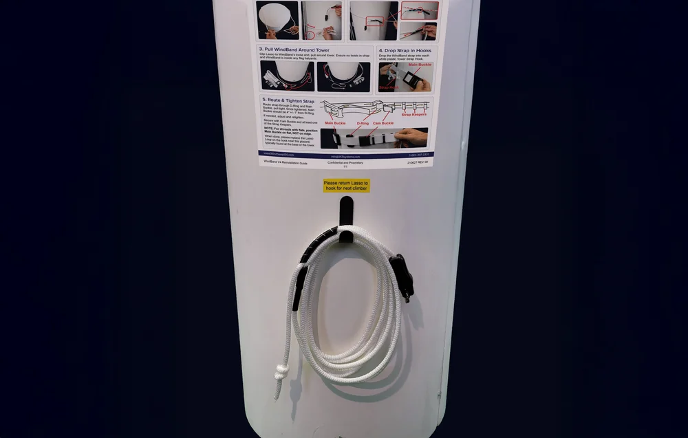 WindBand reinstallation placard and Lasso Loop on its hook at the base of a tower