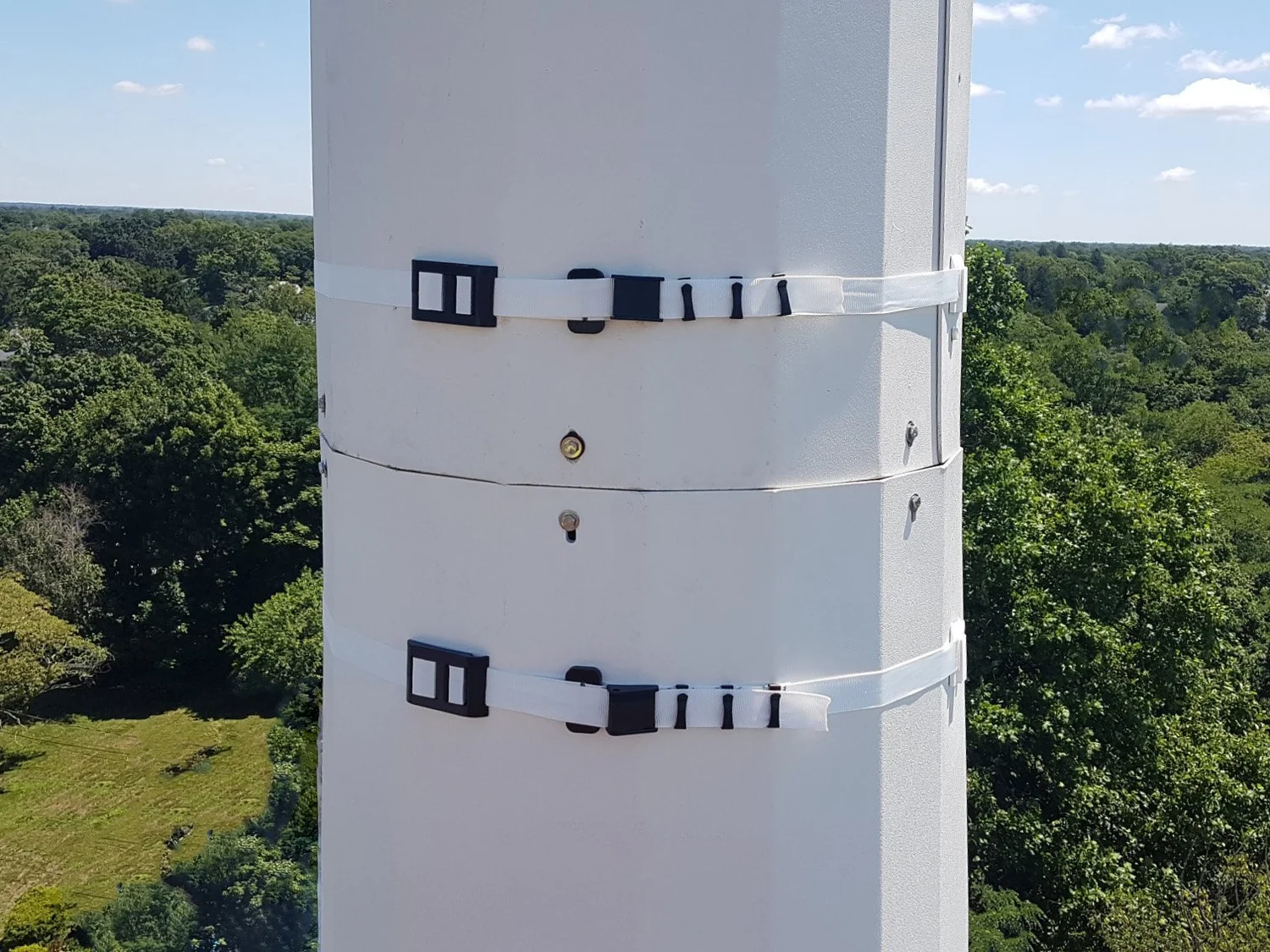 WindBands securing shrouds on a concealment tower