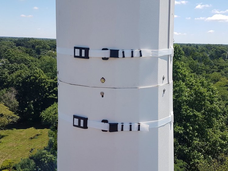 WindBands securing shrouds on a concealment tower