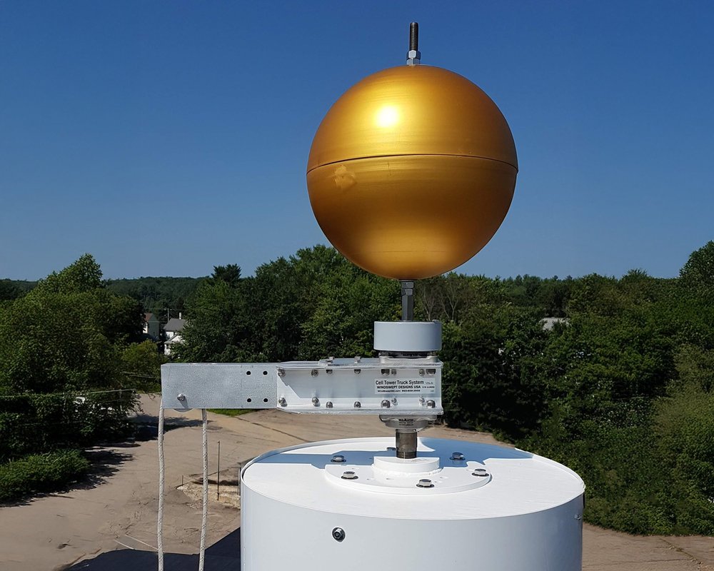 SwingArm Truck and finial ball at the top of a flagpole cell tower