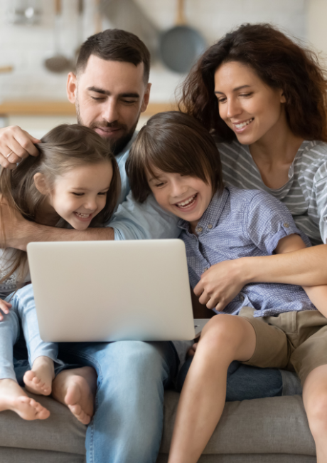 Parent and child looking at a laptop together at home