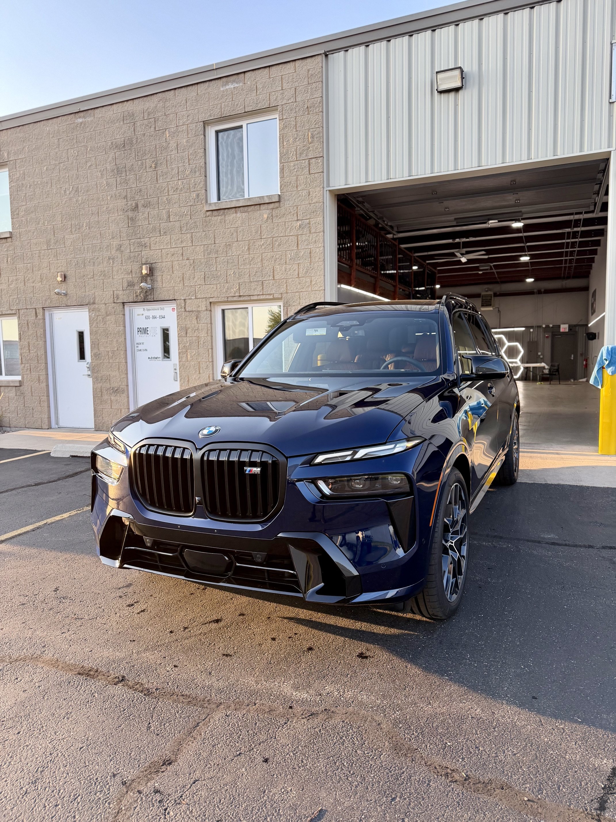 BMW X7 SUV with partial front paint protection film installed at PrimeVue Protection