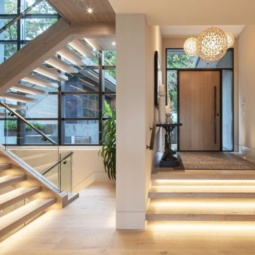 Entryway lighting system with professionally installed architectural fixtures and smart lighting controls