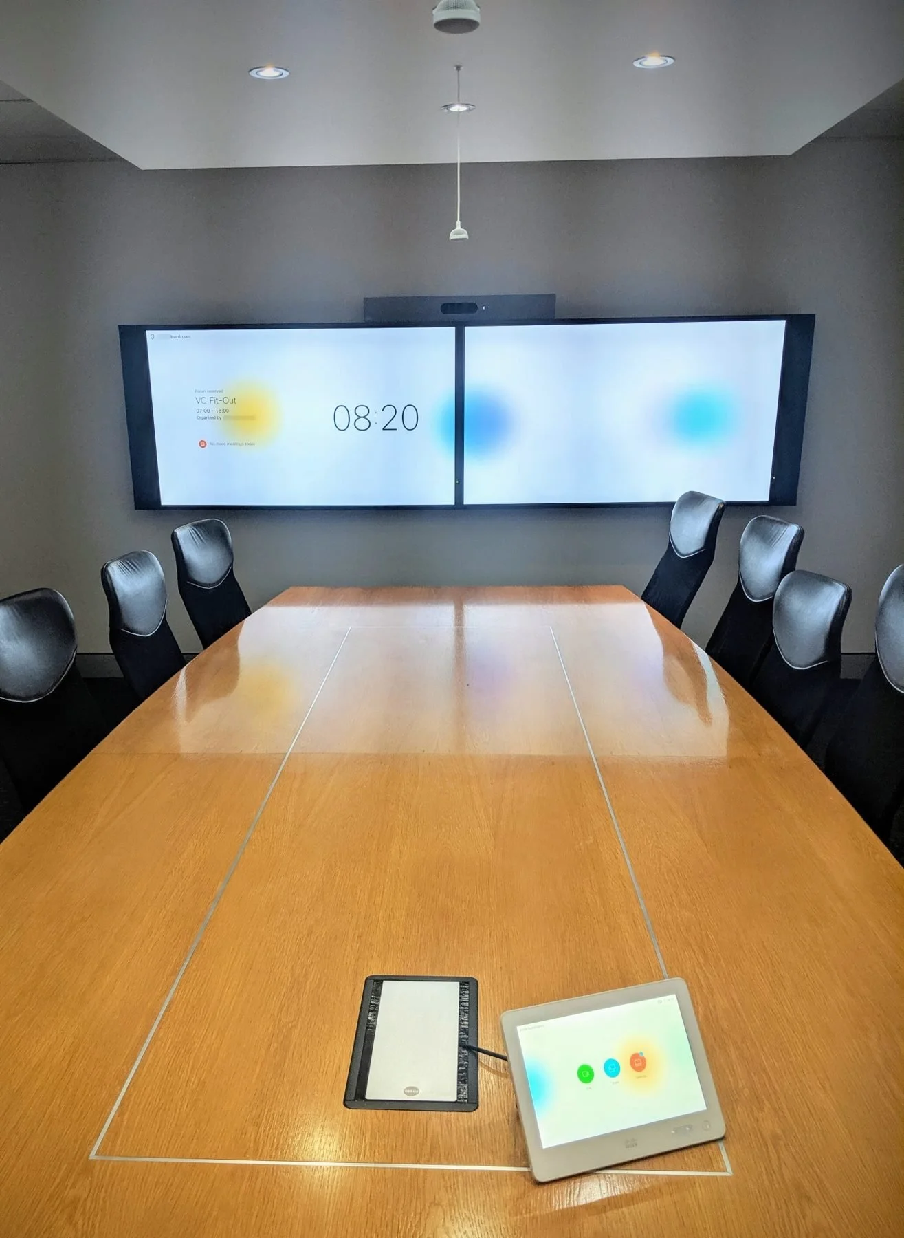 Boardroom with dual displays and Crestron control installed by Connective Integrations, Brisbane