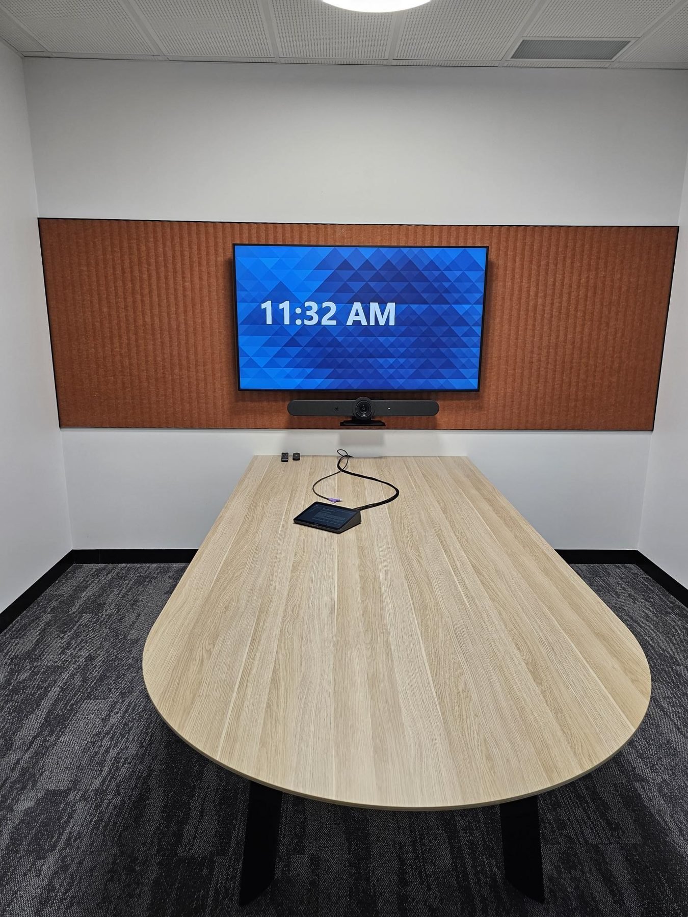 Microsoft Teams Room with display mounted on a timber feature wall, Gold Coast office