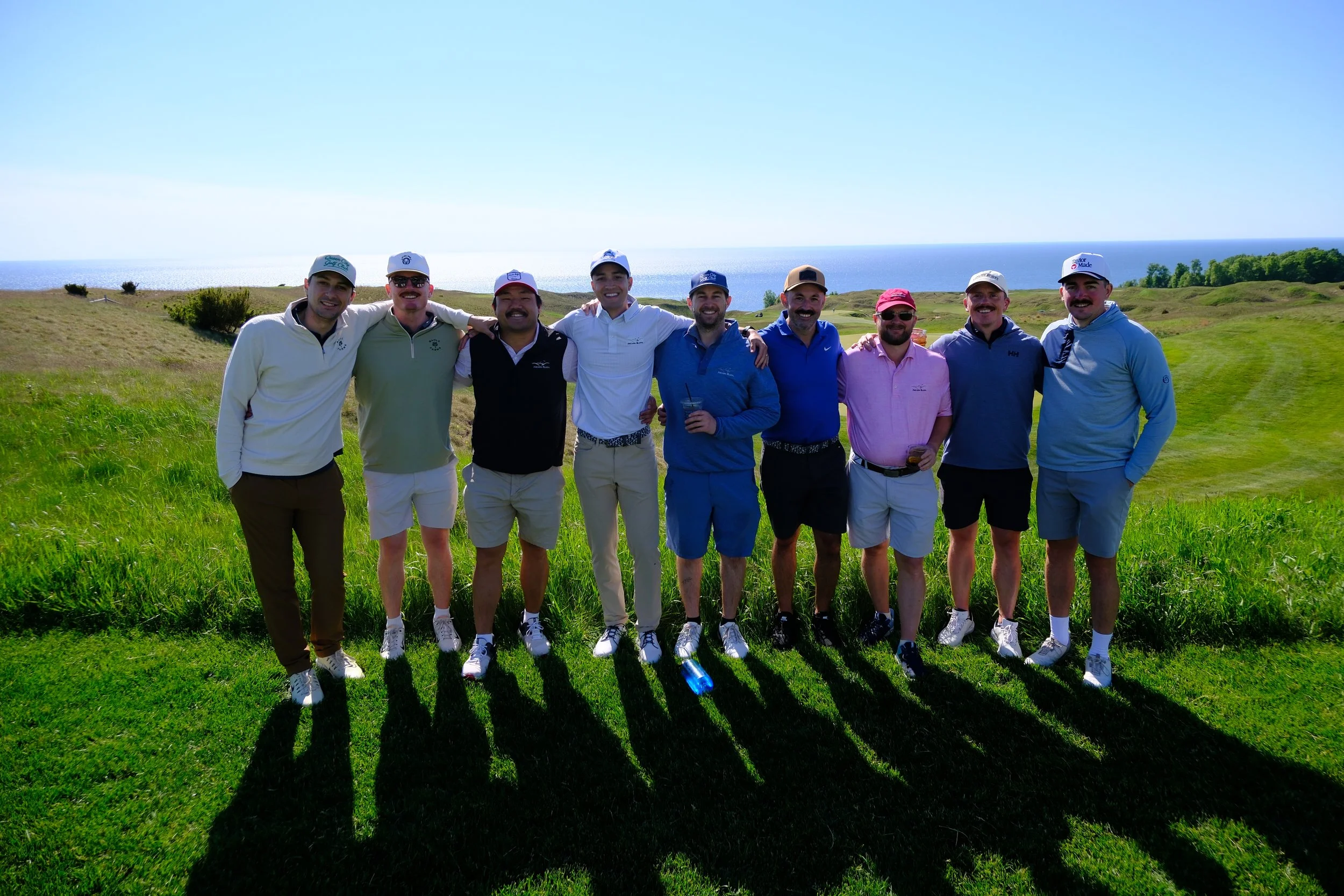 Queen City Golf Club members together at Arcadia Bluffs