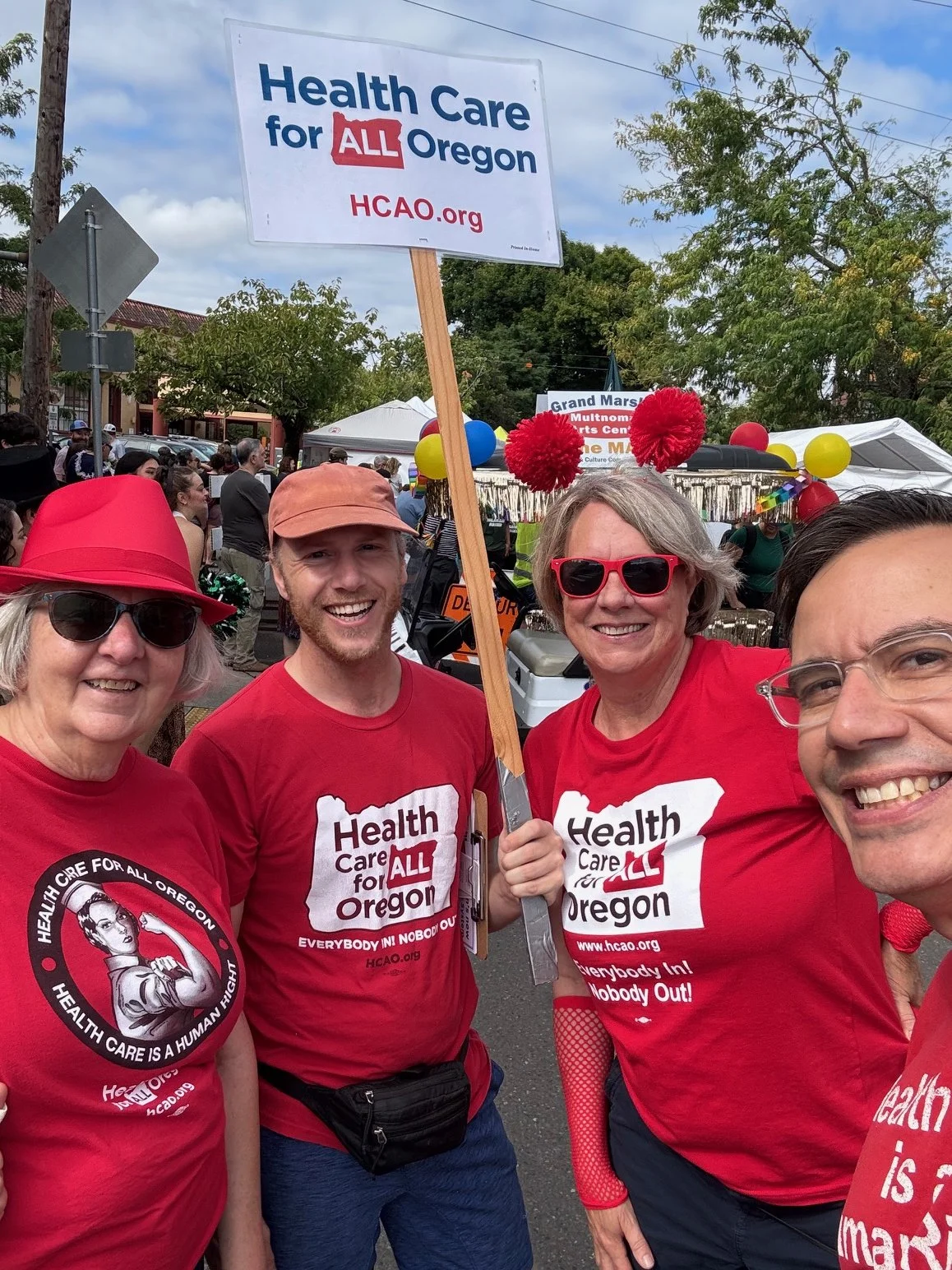 HCAO members holding a sign at a rally