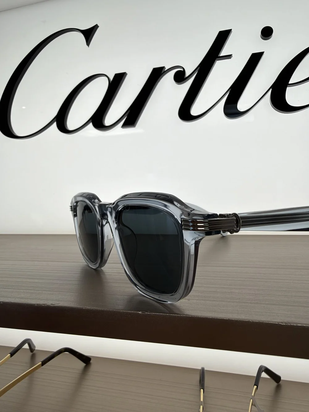 Cartier transparent blue acetate frame, available at Duovision in Montreal