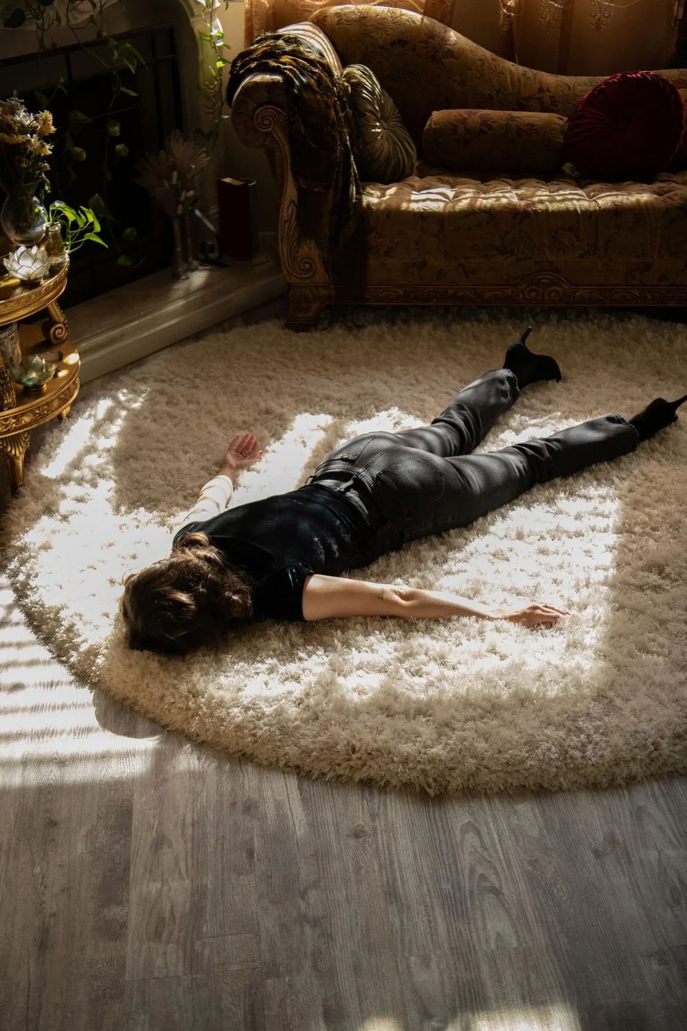 Liz lying on a rug in afternoon light