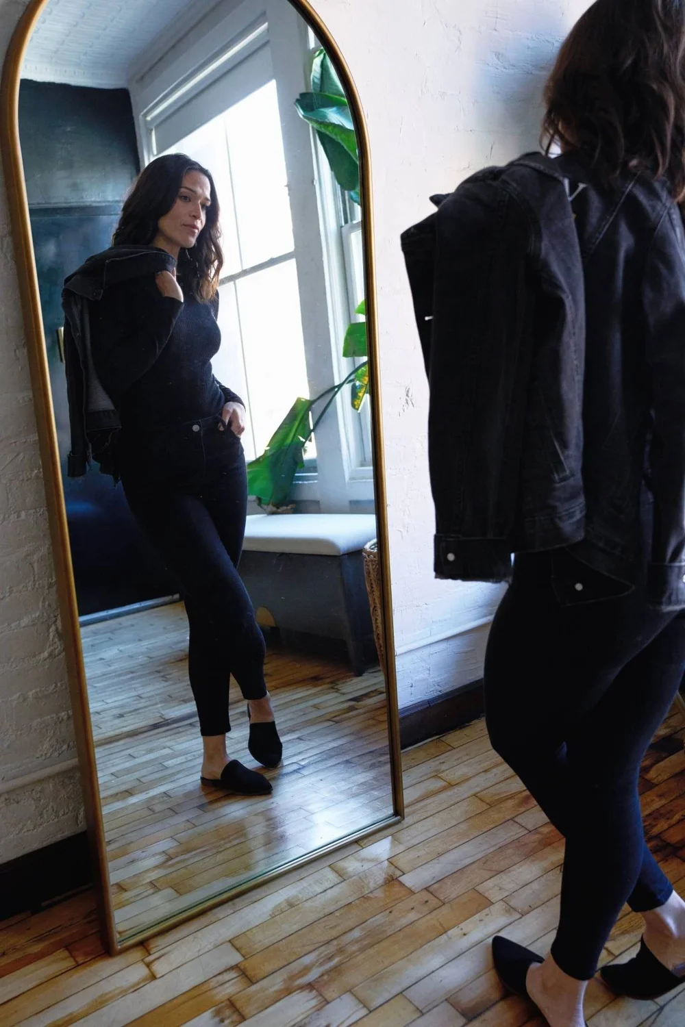 Liz by an arched mirror in her studio