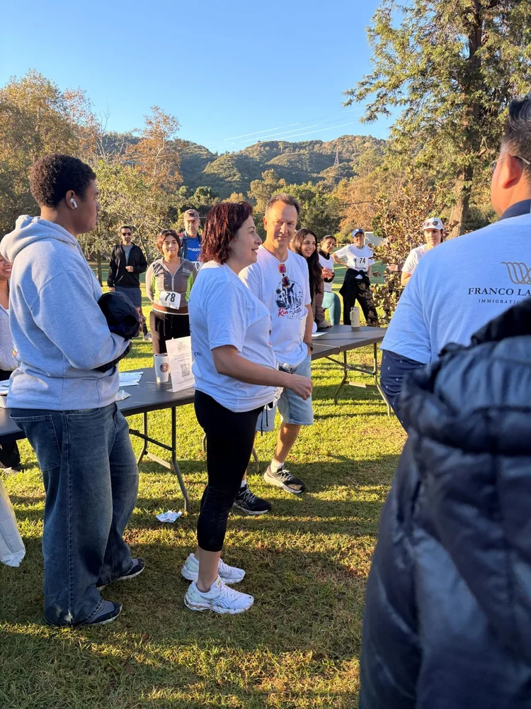 Participants gather at the event table in Griffith Park