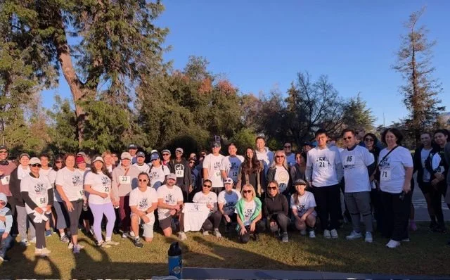Runners and walkers gather for a group photo at Griffith Park