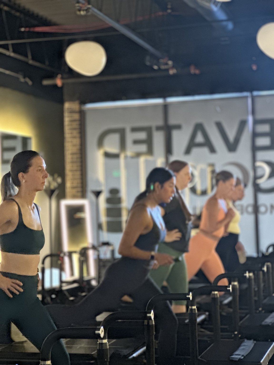Clients moving together in the Elevated Soul studio