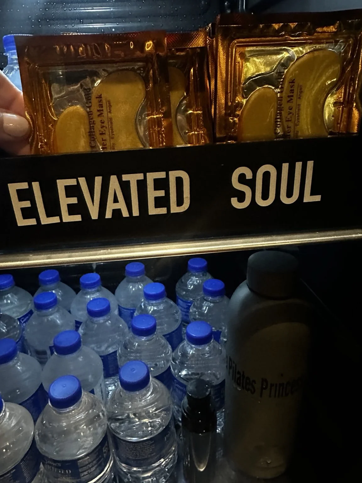 Chilled bottled water and eye patches in the studio refrigerator