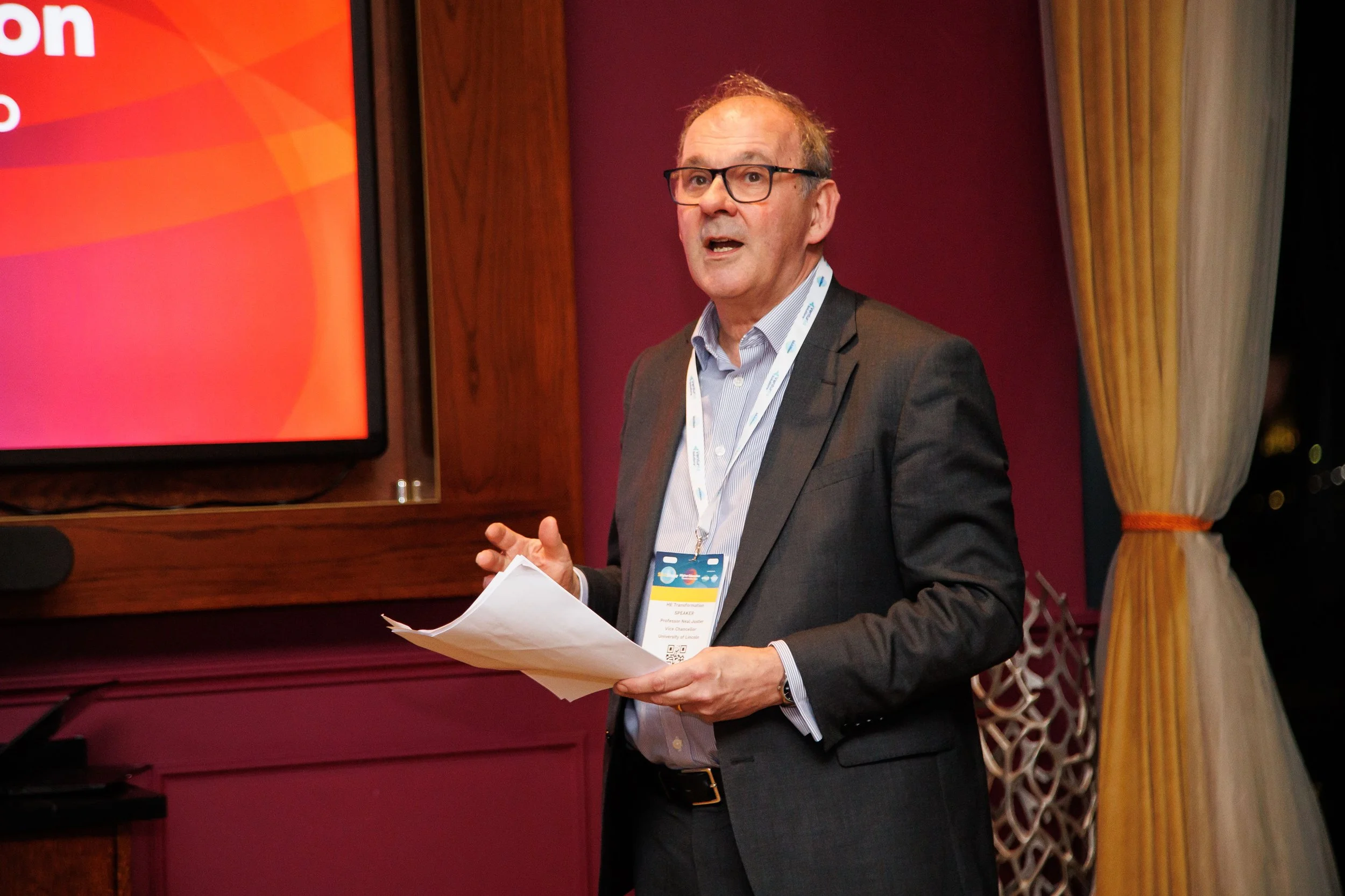 Speaker presenting at HE Transformation