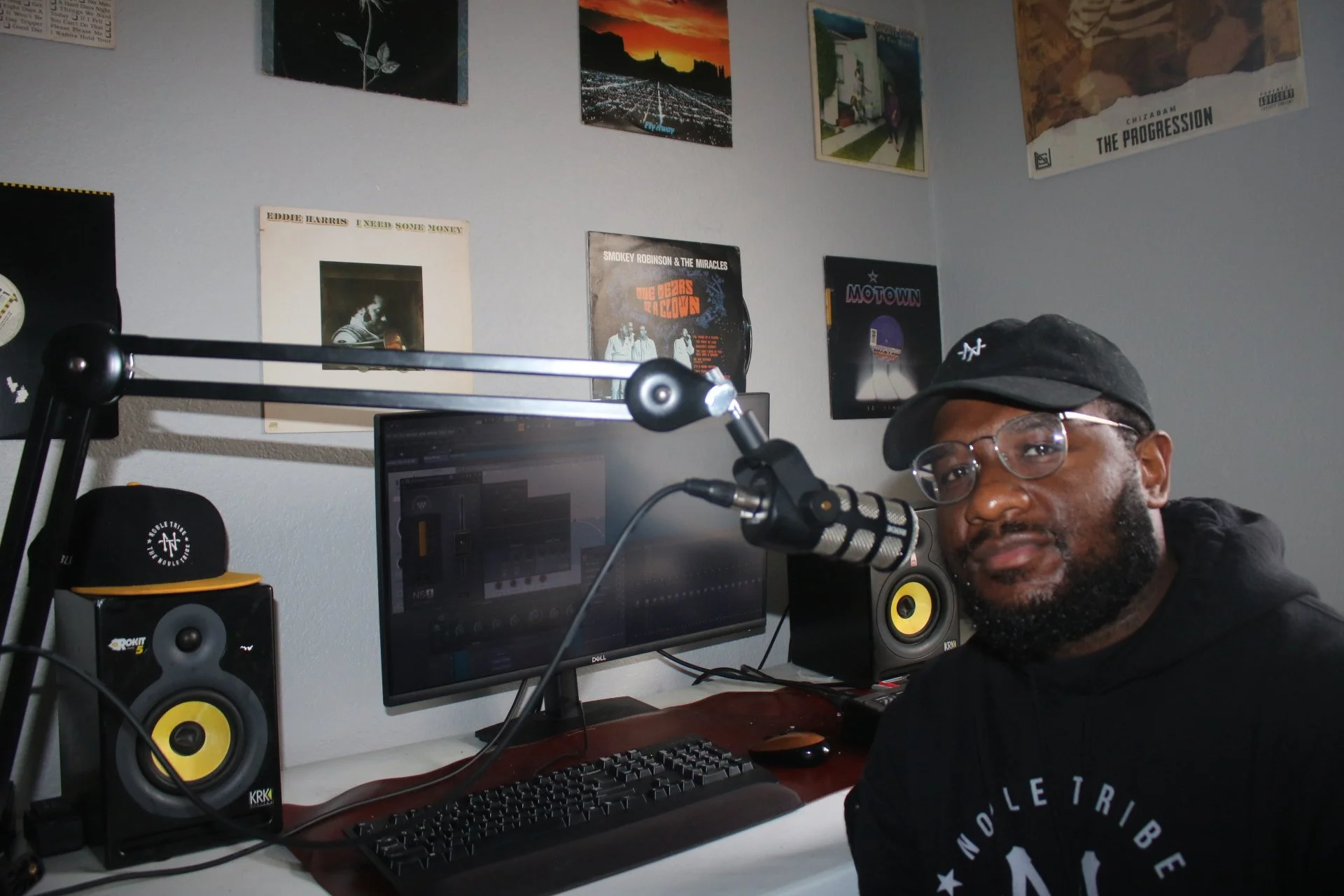 Chizabam seated at his studio workstation, facing the camera