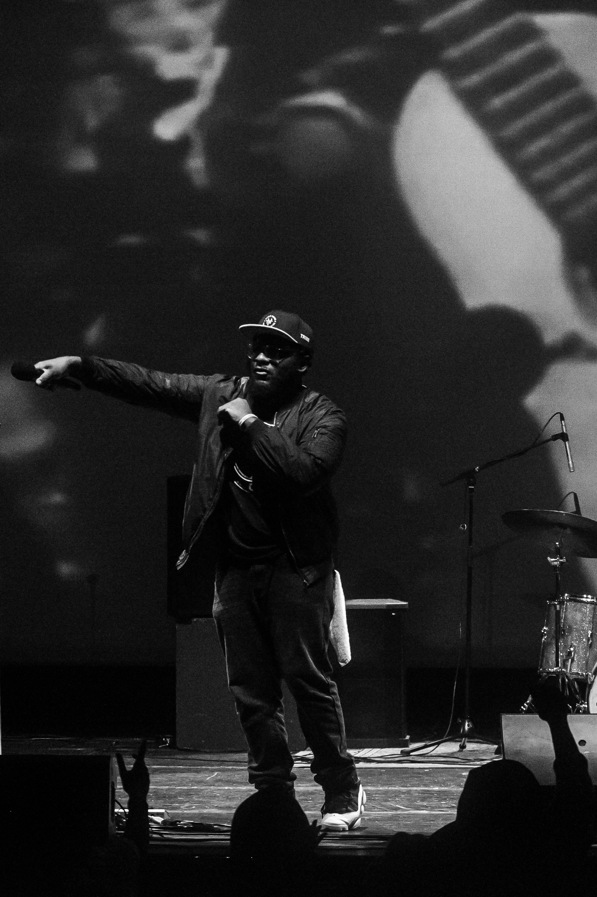 Chizabam performing onstage with a handheld microphone