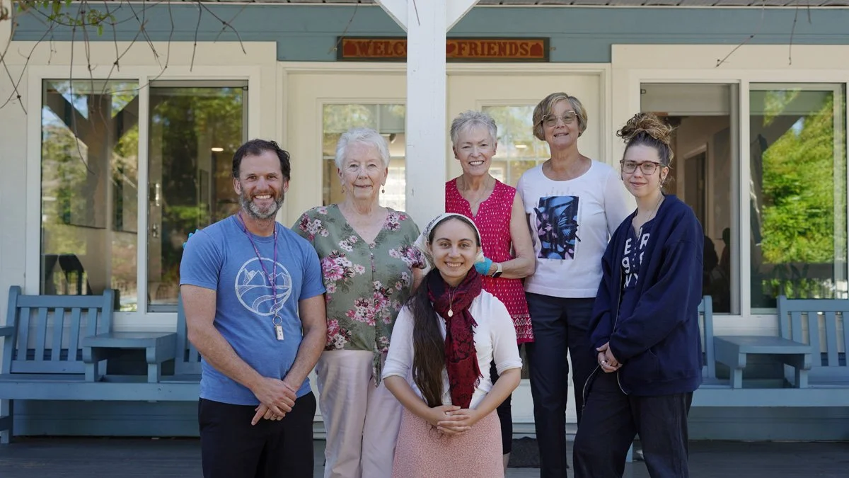 Staff and volunteers on the veranda at Anawim House