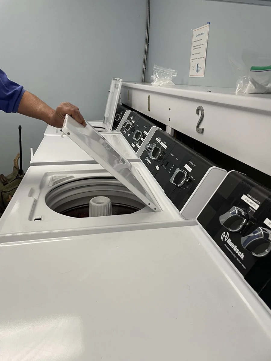 The washing machines in the Anawim laundry room