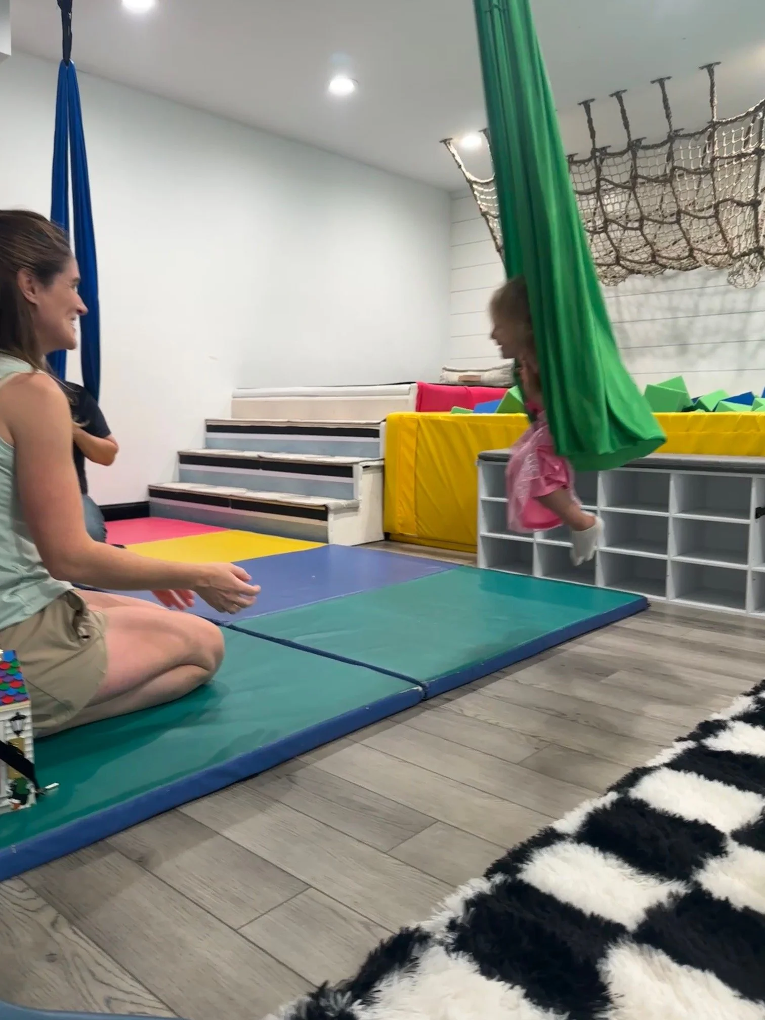 Child on a sensory swing in the movement room at The Clubhouse — sensory play for toddlers in Phoenixville PA