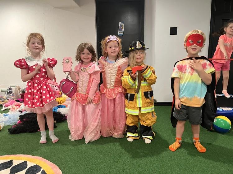 Kids lined up in dress-up costumes at The Clubhouse