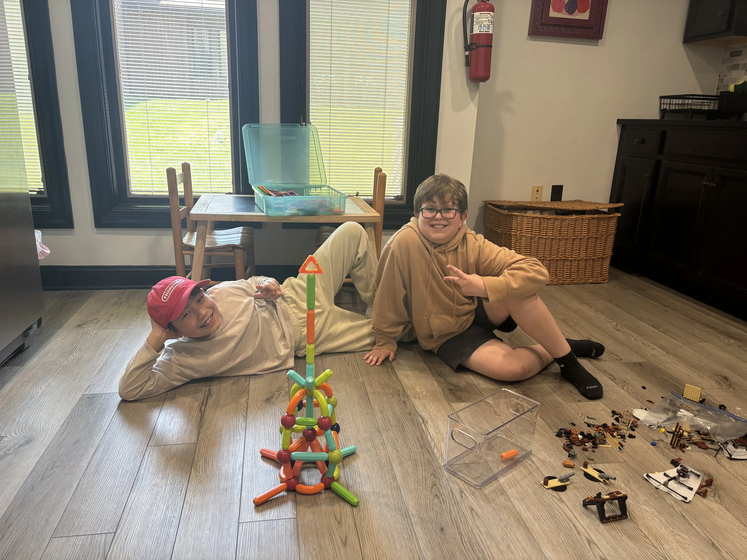 Tween boys building with magnetic tiles at The Clubhouse